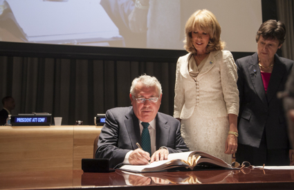 Minister Costello is pictured signing the Treaty. Also in the picture are UN Under Secretary General for Legal Affairs, Patricia O'Brien and UN High Representative for Disarmament Affairs, Angela Kane