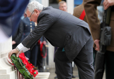 Minister of State Joe Costello lays a wreath at the Cenotaph at Belfast City Hall